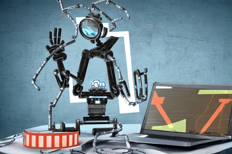 A picture depicting a robot holding a magnifying glass looking at an open laptop computer showing code onscreen with caution tape behind it