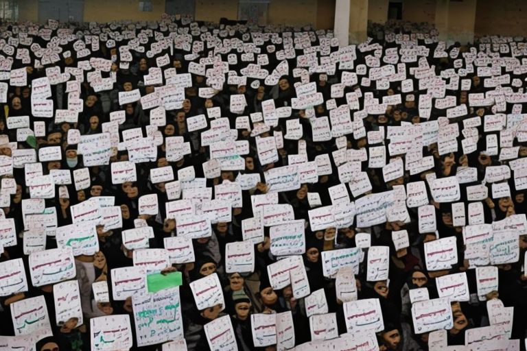 A picture depicting people protesting against Saudi's ban on Abaya in exam halls with signs reading "No To Sanghi Arabia"