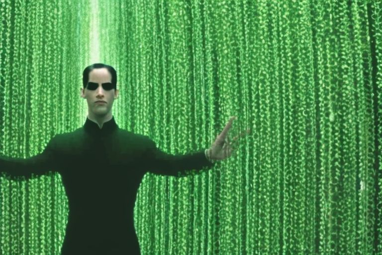 A still image from 'The Matrix' featuring Neo standing confidently amidst a sea of green code